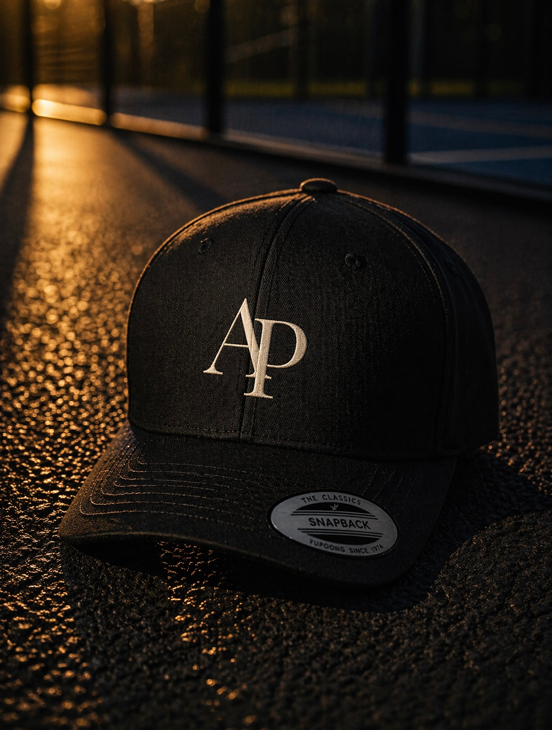 Black AP Club cap with a logo on a textured surface